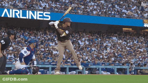 Baseball Player Swinging At Pitch In Front Of Airlines Banner GIF