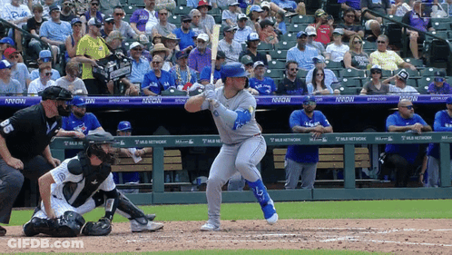 Baseball Player Swinging At Pitch In Front Of Nixon Banner GIF