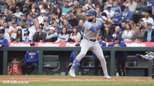 Baseball Player Swinging At Pitch Sponsored By Fred Meyer GIF