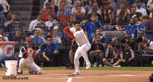 Baseball Player Swinging At Pitch With Gatorade Sign GIF