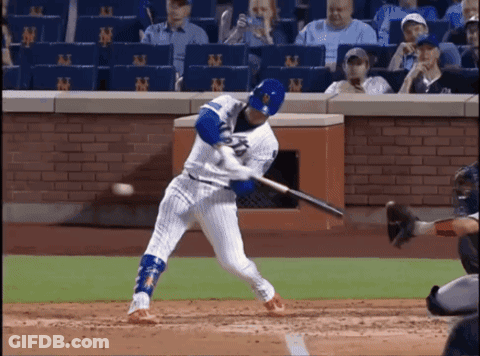 Baseball Player Swinging Bat At Ball With NY Wall GIF