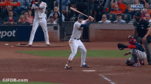 Baseball Player Swinging Bat At Chevron Sign GIF