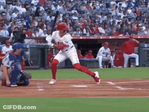 Baseball Player Swinging Bat At Pitch GIF