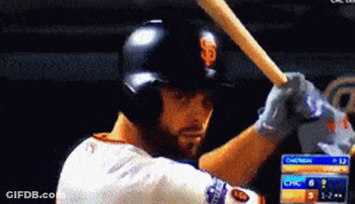 Baseball Player Swinging Bat In Front Of Chasers Scoreboard GIF