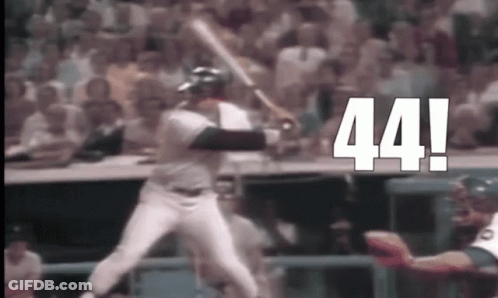Baseball Player Swinging Bat In Front Of Crowd GIF
