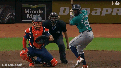 Baseball Player Swinging Bat In Front Of Duke Energy Banner GIF