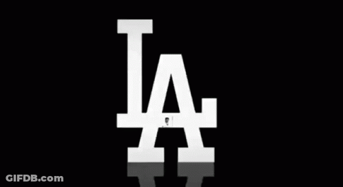 Baseball Player Swinging Bat In Front Of LA GIF