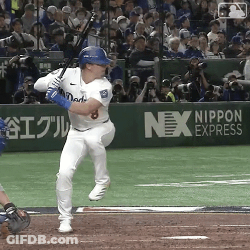 Baseball Player Swinging Bat In Front Of Nex Express Ad GIF