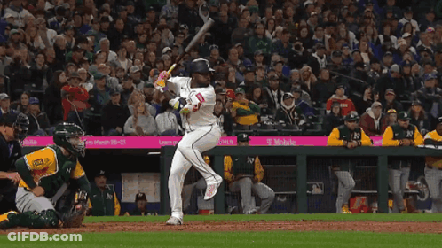 Baseball Player Swinging Bat In Front Of T-Mobile Sponsored Crowd GIF