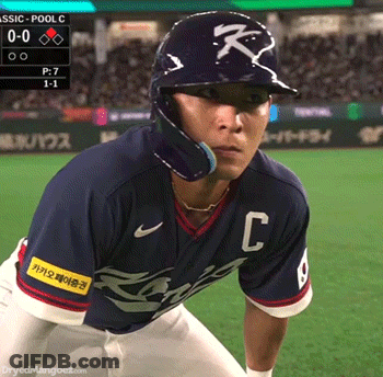 Baseball Player Swinging Bat In Front Of Yankees Sign GIF