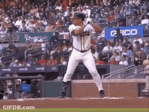 Baseball Player Swinging Bat In Stadium GIF