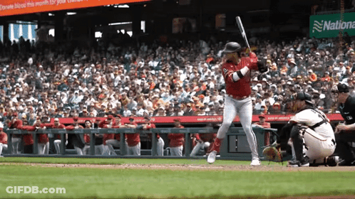 Baseball Player Swinging Bat Near National Bank Sign GIF