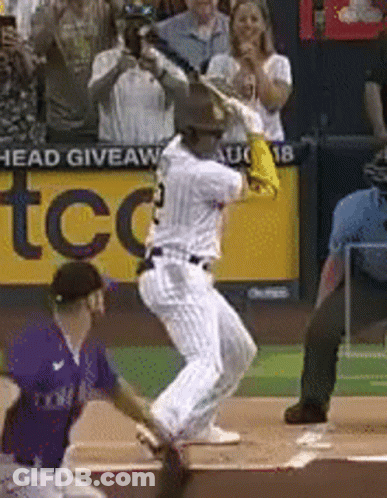 Baseball Player Swinging Bat Near TCC Sign GIF