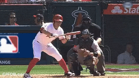 Baseball Player Swinging Bat While Catcher Watches GIF