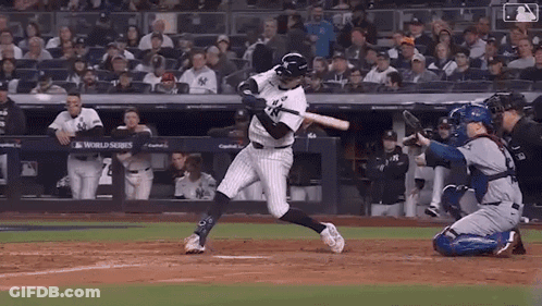 Baseball Player Swinging Bat With Catcher Watching GIF