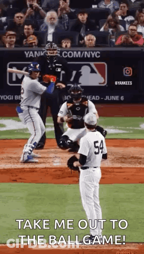 Baseball Player Swinging Bat With Pitcher On Mound GIF