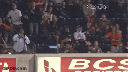 Baseball Player Swinging Bat With Watching Crowd GIF