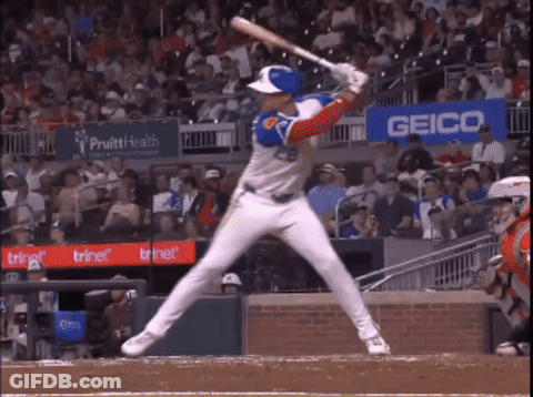Baseball Player Swinging Near Geico Sign GIF