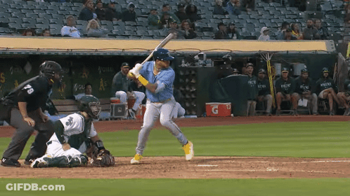 Baseball Player Swinging With Gatorade Cooler GIF