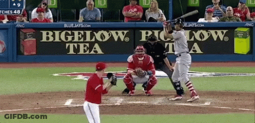 Baseball Player Swings At Pitch In Front Of Bigelow Tea Sign GIF