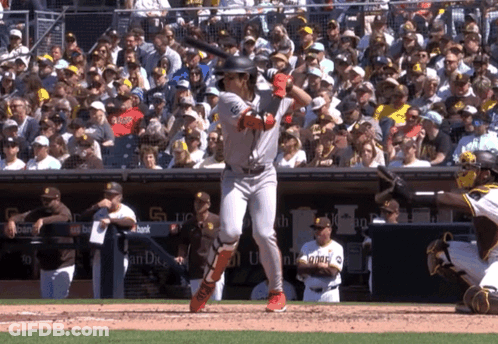 Baseball Player Throwing Ball In Front Of Sub Above Sign GIF