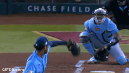 Baseball Player Throws Ball In Front Of Chase Field Sign GIF