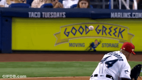 Baseball Player Throws Ball In Front Of Good Greek Sign GIF