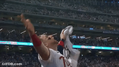 Baseball Player Throws Ball Under Delta Sky Banner GIF