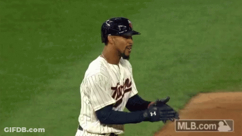 Baseball Player Wearing Helmet With T GIF