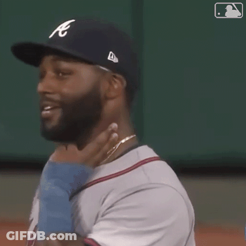 Baseball Player With Beard Smiling Holding Baby GIF