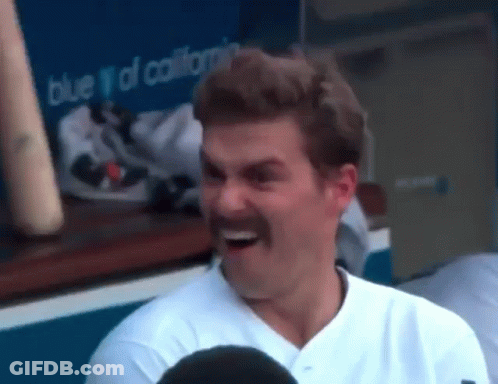 Baseball Player With Mustache Laughing In Dugout GIF