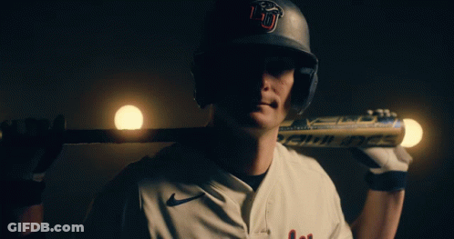 Baseball Player With U Helmet Holding Bat Over Shoulder GIF