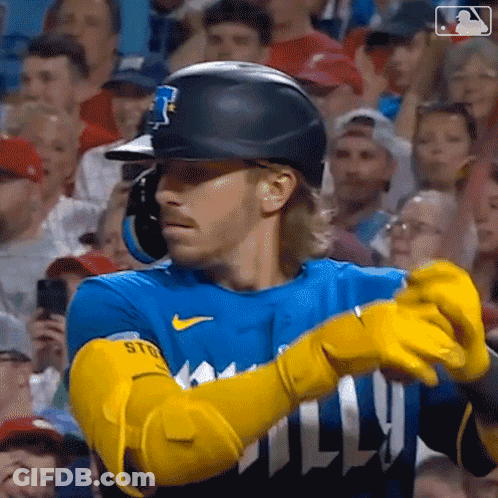 Baseball Player With Yellow Gloves And Helmet Facing Crowd GIF
