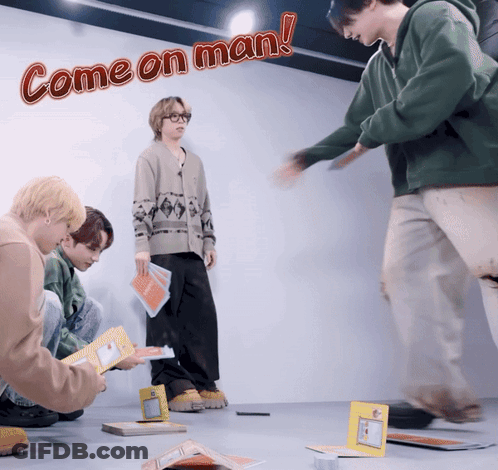 Baseball Players Around Man In Red Hat GIF