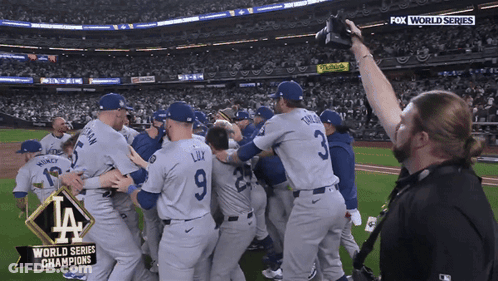 Baseball Players Celebrating World Series Win GIF
