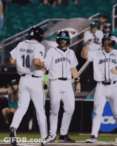 Baseball Players For The Coastal Team Are Celebrating A Home Run GIF