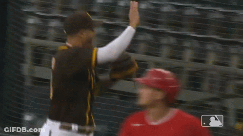 Baseball Players Giving High Five GIF