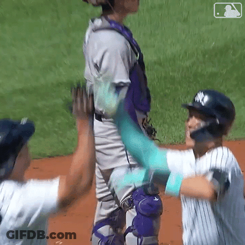 Baseball Players High Five On Field GIF
