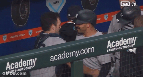 Baseball Players Hugging In Academy Sports Outdoors Dugout GIF