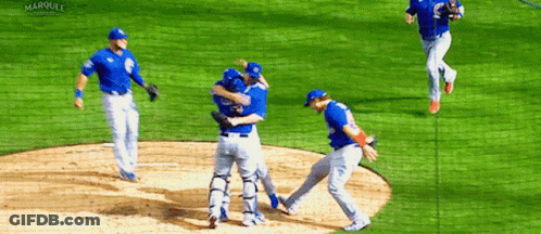 Baseball Players Hugging On Field GIF
