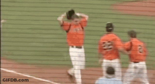 Baseball Players Hugging On Field GIF