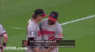 Baseball Players Hugging On Field GIF