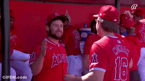 Baseball Players In Dugout With Number 16 GIF