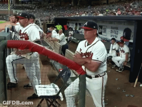 Baseball Players In Dugout With On-Field Cap Sign GIF