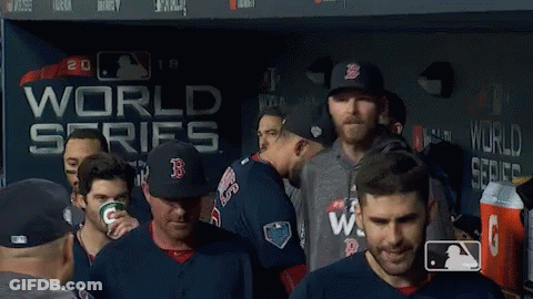 Baseball Players In Front Of World Series Wall GIF