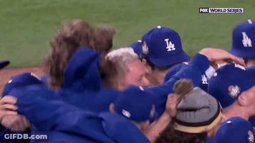 Baseball Players In LA Hats Huddling GIF