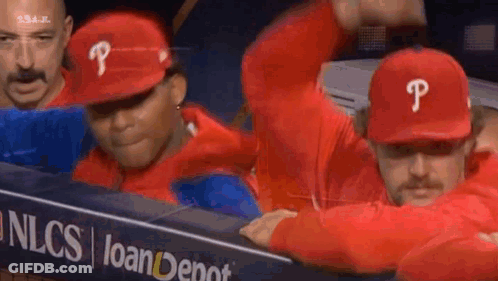 Baseball Players In Red P Hats In Dugout GIF
