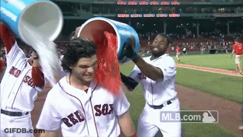 Baseball Players In Red Sox Uniforms Pouring Red Powder GIF