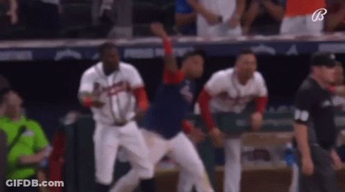Baseball Players Jumping In Dugout GIF