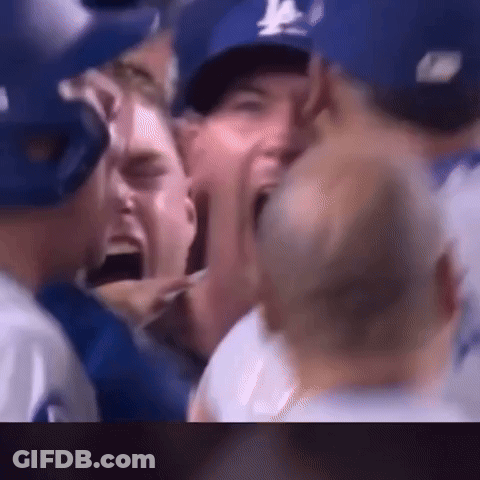 Baseball Players Screaming In Crowd Wearing Blue Hats GIF